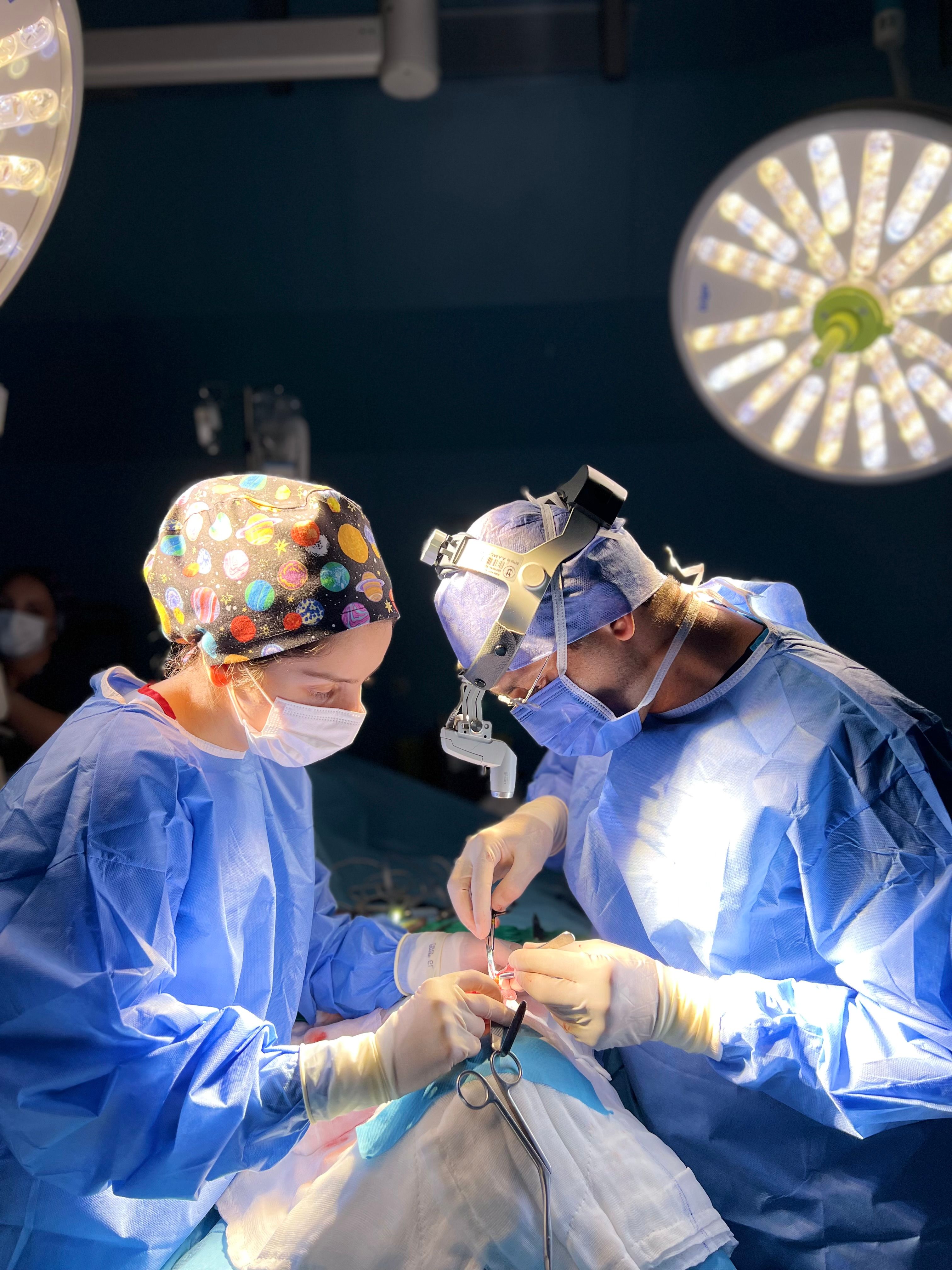 Surgeons Performing Operation in Well-lit Theater · Free Stock Photo