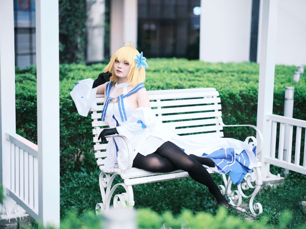 Bench Cos Cosplayer Relaxing on a White Garden Bench · Free Stock Photo