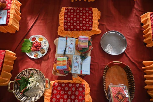 Richly decorated setup for a traditional Gujarati wedding ceremony with vibrant colors and cultural items.