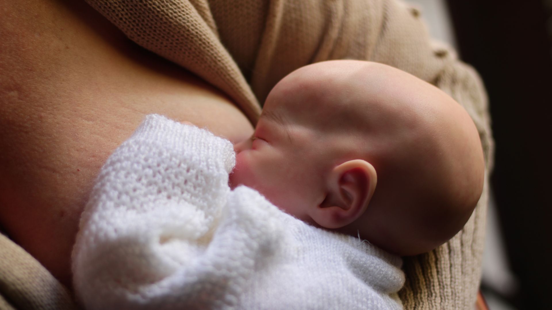 Modafinil Safety While Breastfeeding: A Comprehensive Guide Tender scene of a mother breastfeeding her newborn in a cozy setting, capturing the essence of maternal care — modafinil safety while breastfeeding