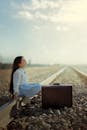 Girl with Suitcase on Railroad Track in Qazvin