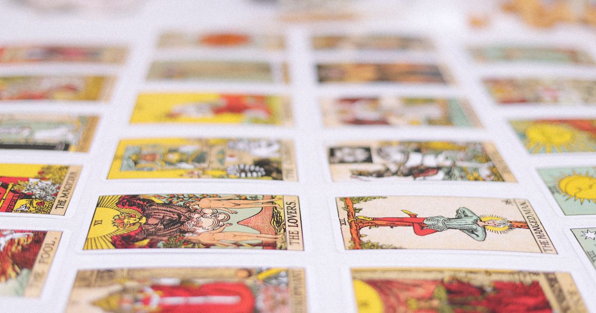 Rider-Waite tarot cards laid out in a grid face up, the 22 major arcana destiny matrix charts are built from
