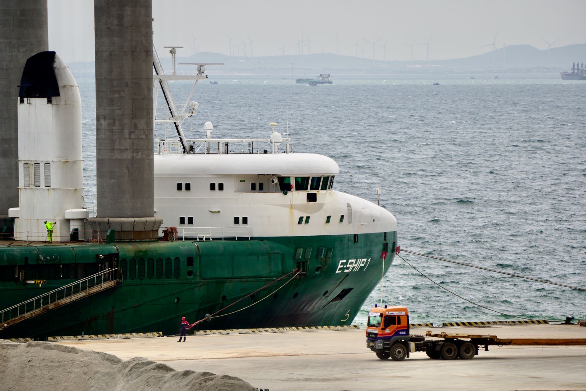 Port workers managing containers at Hell-Ville port Nosy Be