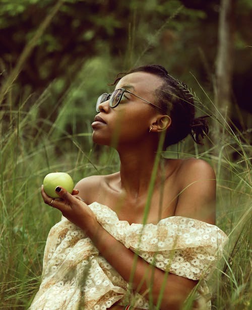 Woman Wearing Beige Top Holding Green Apple