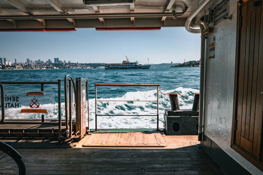 View of Istanbul and Bosphorus from a ferry showcasing the iconic skyline and sea travel experience.