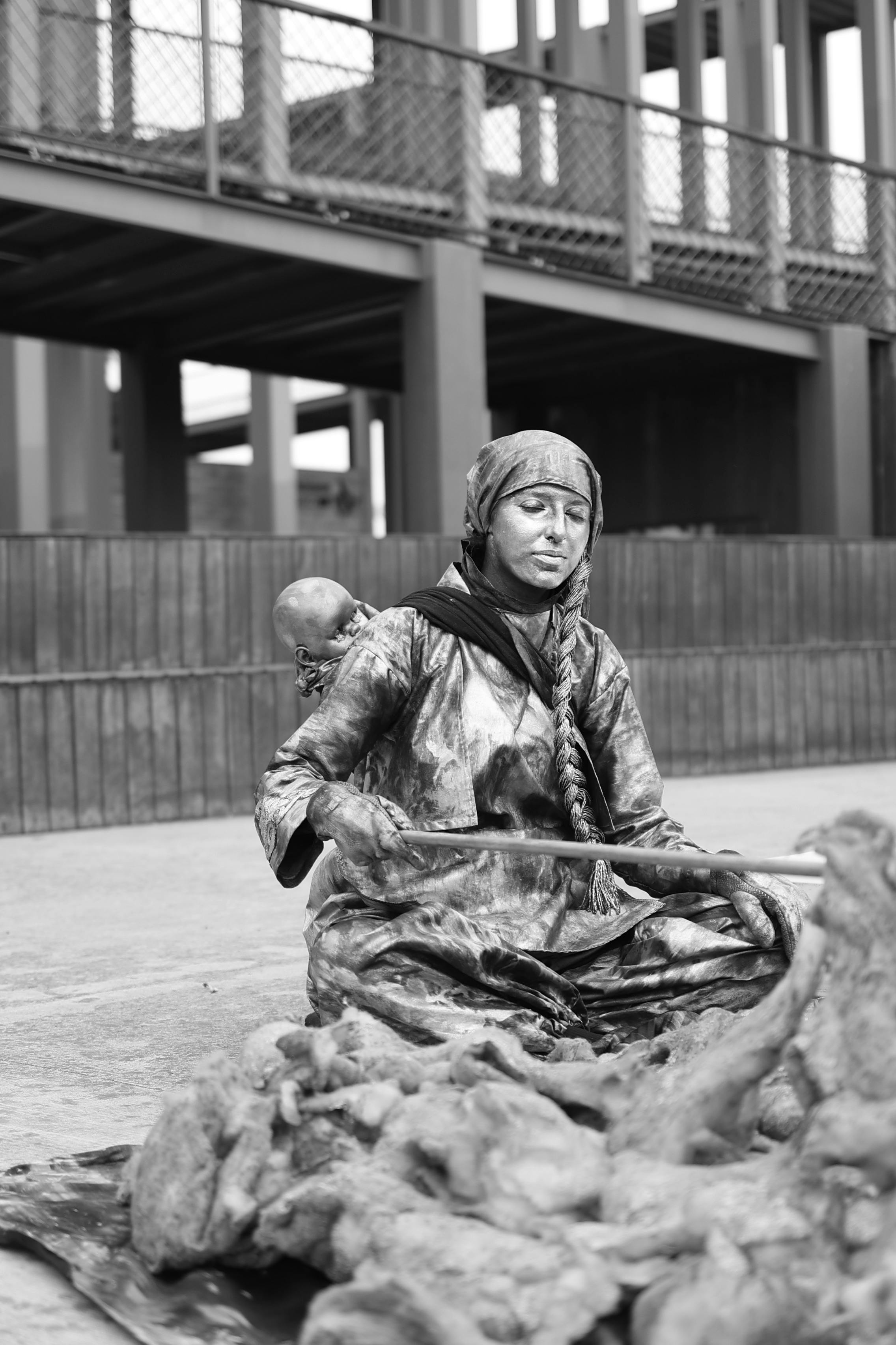 Free Black and white photo of a street performer in Samsun, resembling a statue. Stock Photo