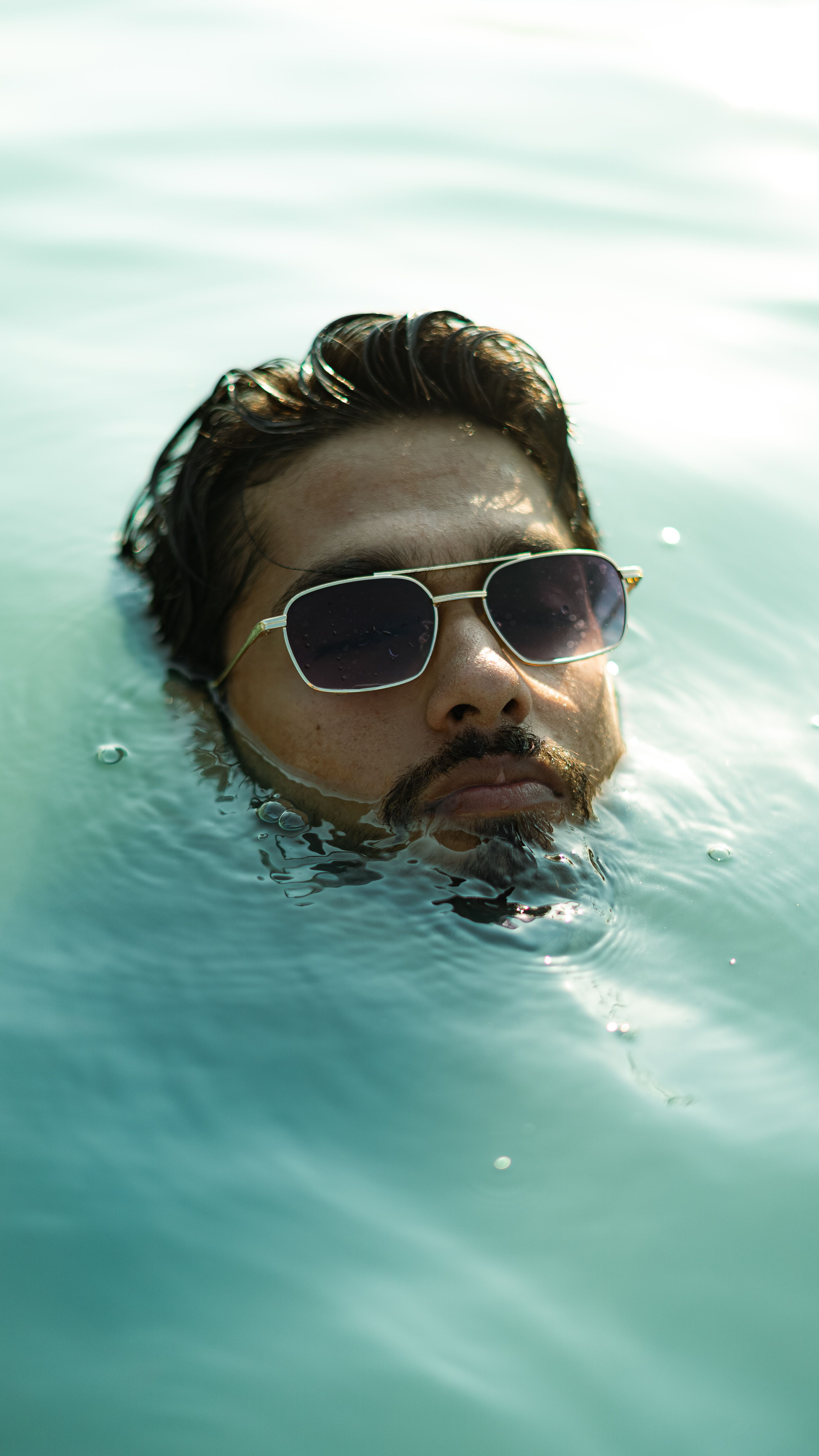 Man in Sunglasses Partially Submerged in Water · Free Stock Photo