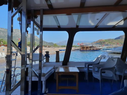 Free Enjoy a tranquil boat view of Turkey's stunning coastline and distant mountains. Stock Photo