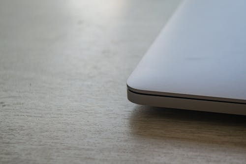 Free Laptop On A Wooden Table Stock Photo