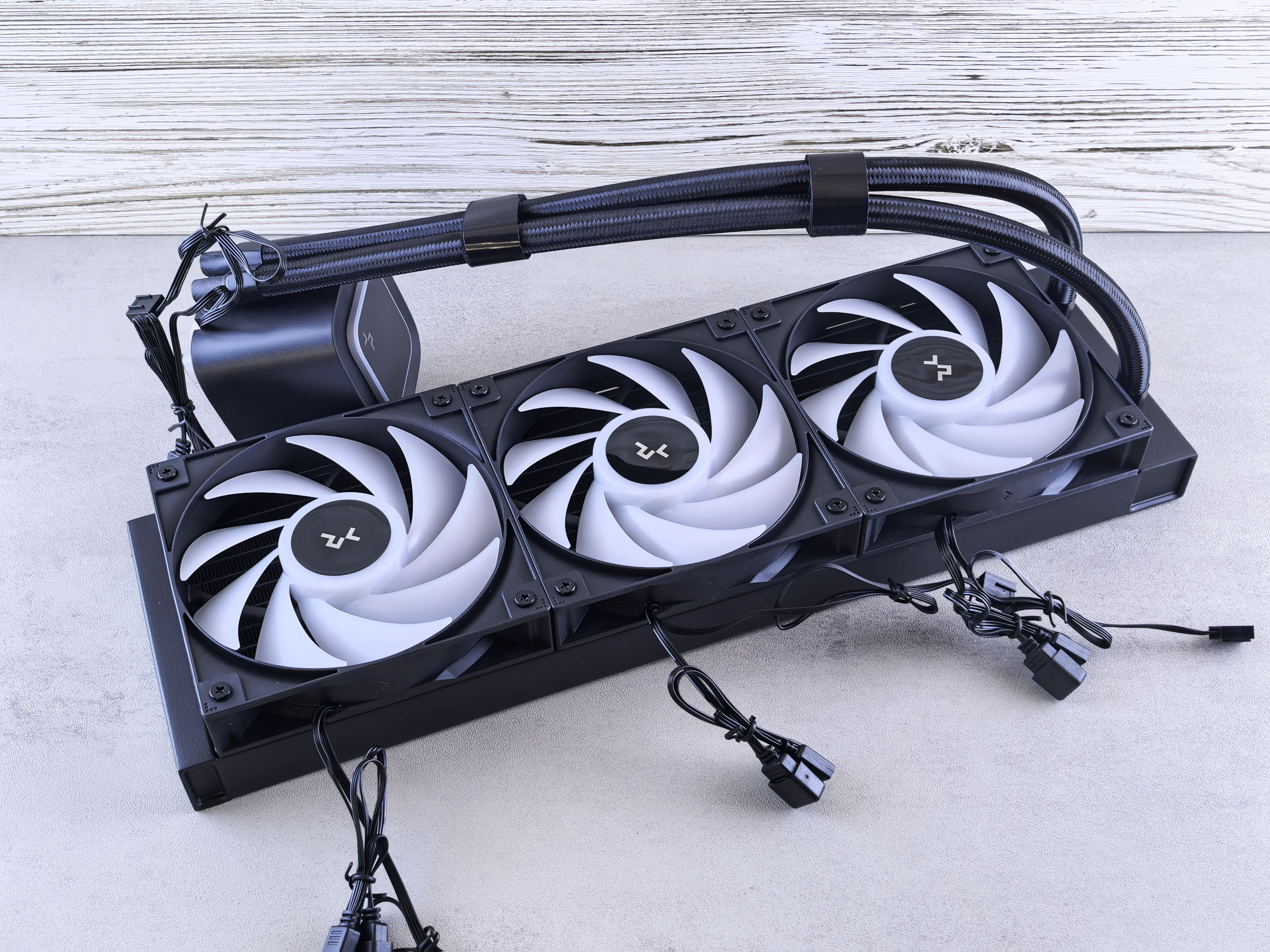 Triple Fan CPU Cooler on Concrete Surface · Free Stock Photo