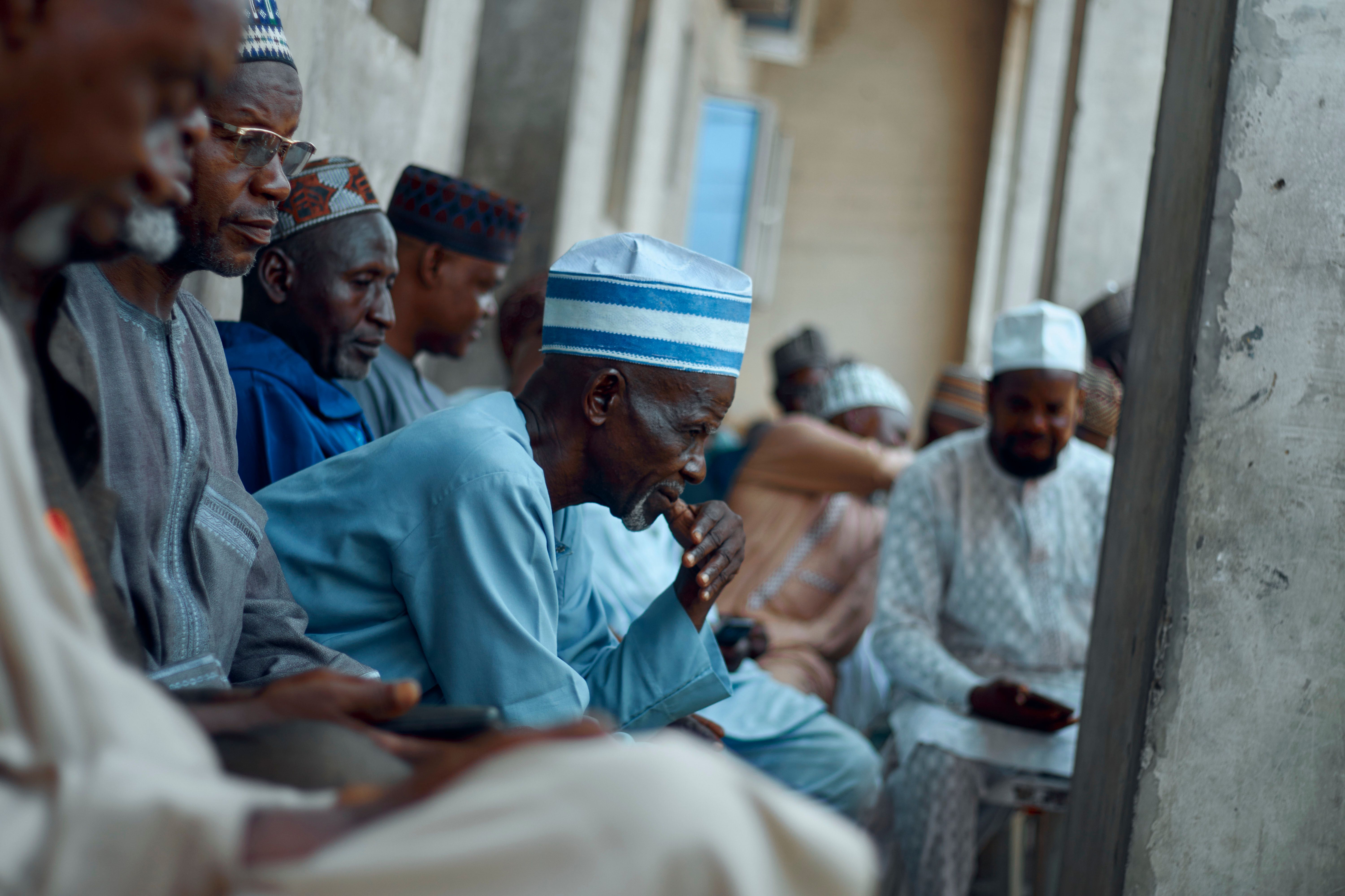 Group of African Men Socializing Outdoors · Free Stock Photo
