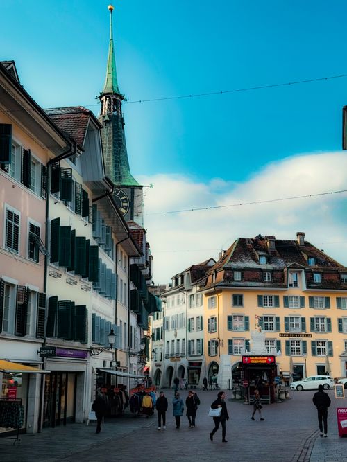 Free Picturesque street scene in Solothurn, showcasing historic architecture under a bright blue sky. Stock Photo