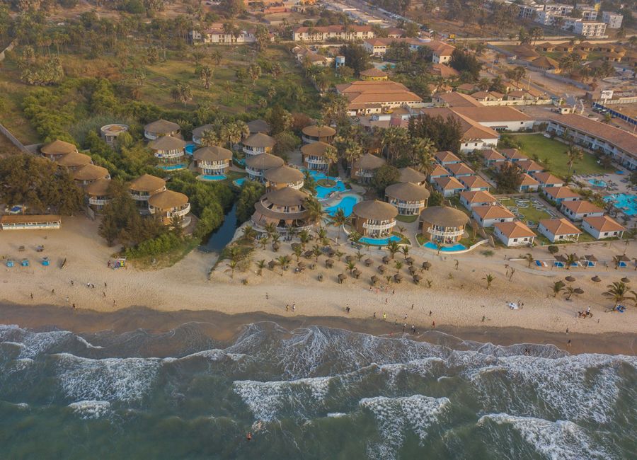 Stunning aerial capture of a beachfront resort in Gambia with coastal beauty.