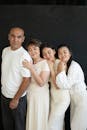 Happy Family Embrace Against Dark Background