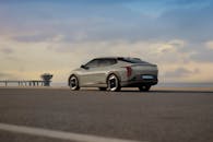 Sleek Electric Vehicle on Scenic Coastal Road