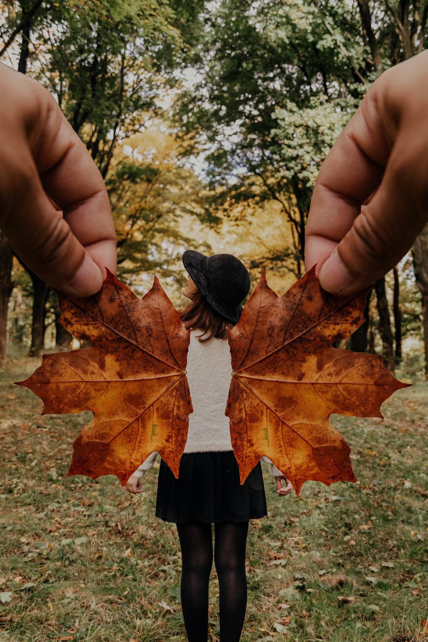 photo of woman standing near trees