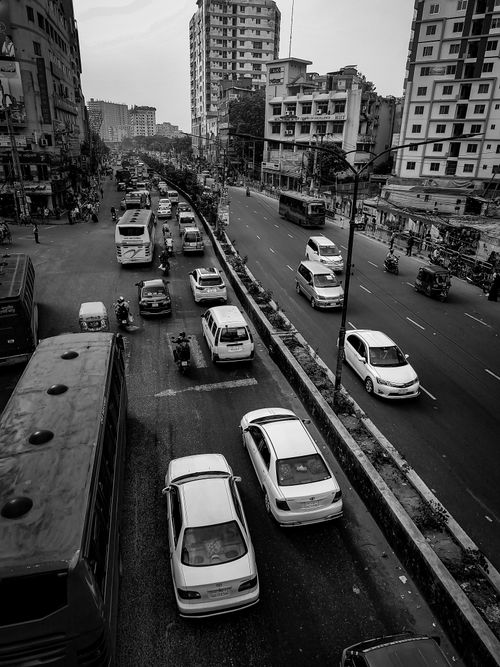 Free Black and white photo capturing busy urban life and traffic in Dhaka, Bangladesh. Stock Photo