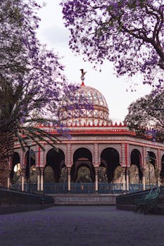 Lovely view of Kiosko Morisco with vibrant jacaranda trees in Mexico City.