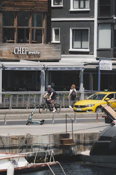 Scenic view of a cyclist and pedestrian along the vibrant waterfront of Istanbul, Türkiye.