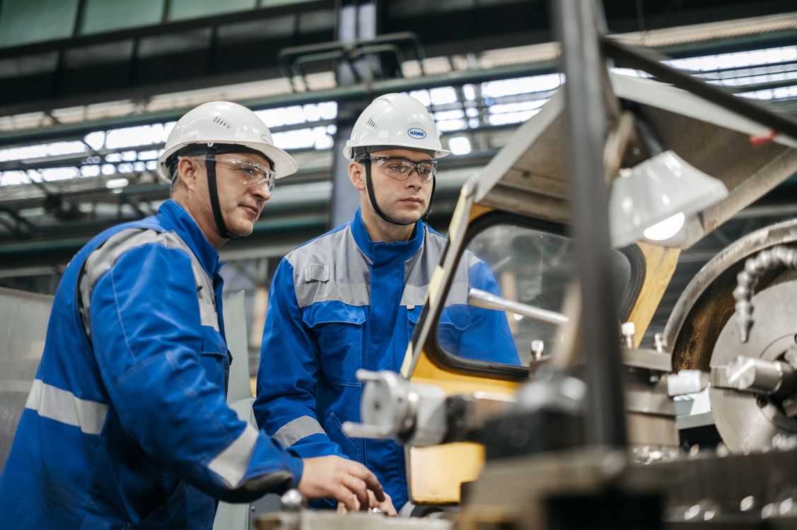 People Using Machine Industrial Workers Operating Machinery Indoors · Free Stock Photo