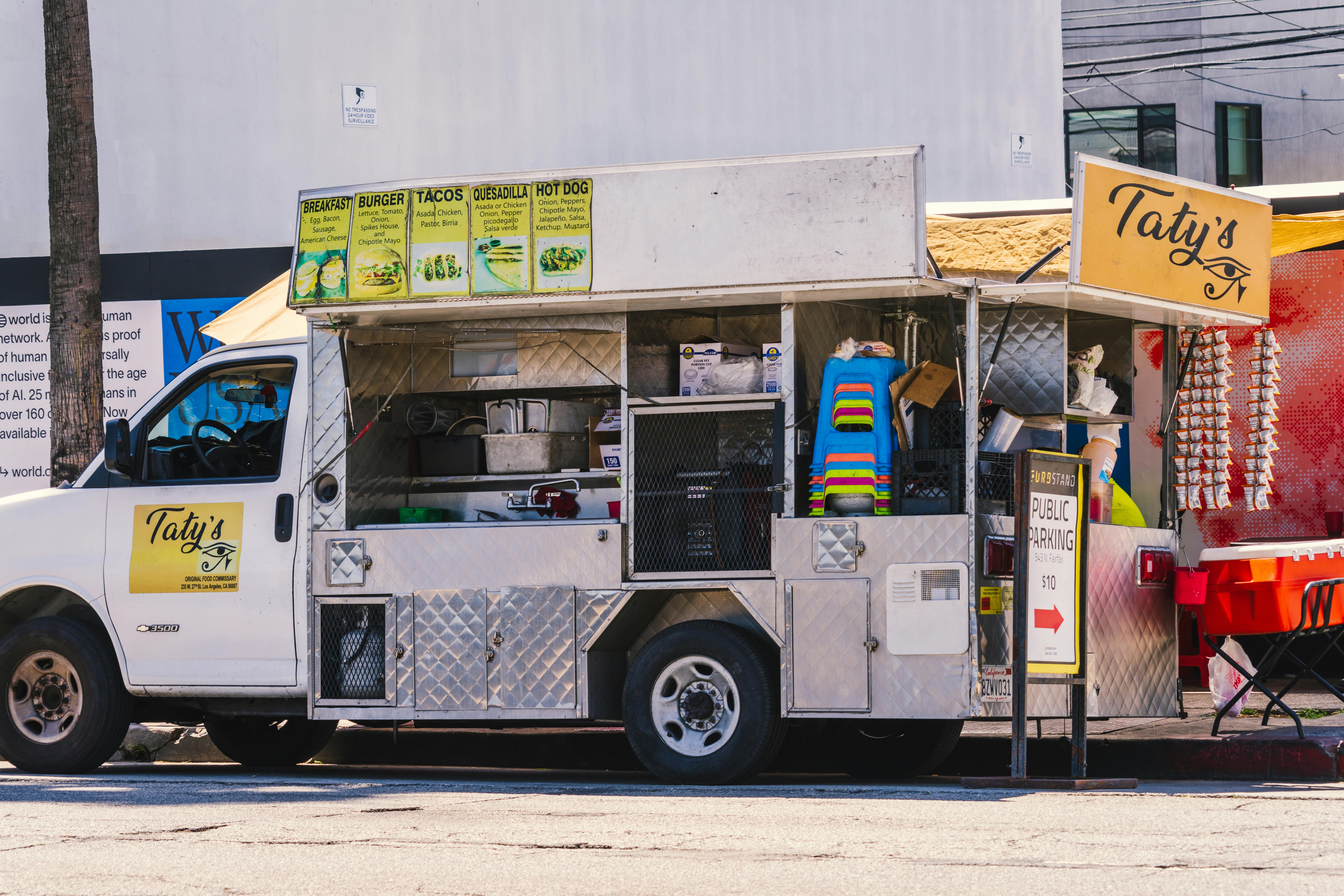 Food truck serving diverse street cuisine on Fairfax Avenue, Los Angeles.