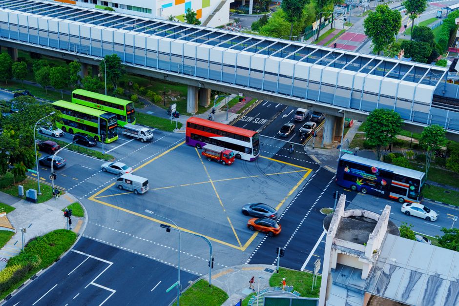 Cars parked in a clean, multi-story public car park in Singapore