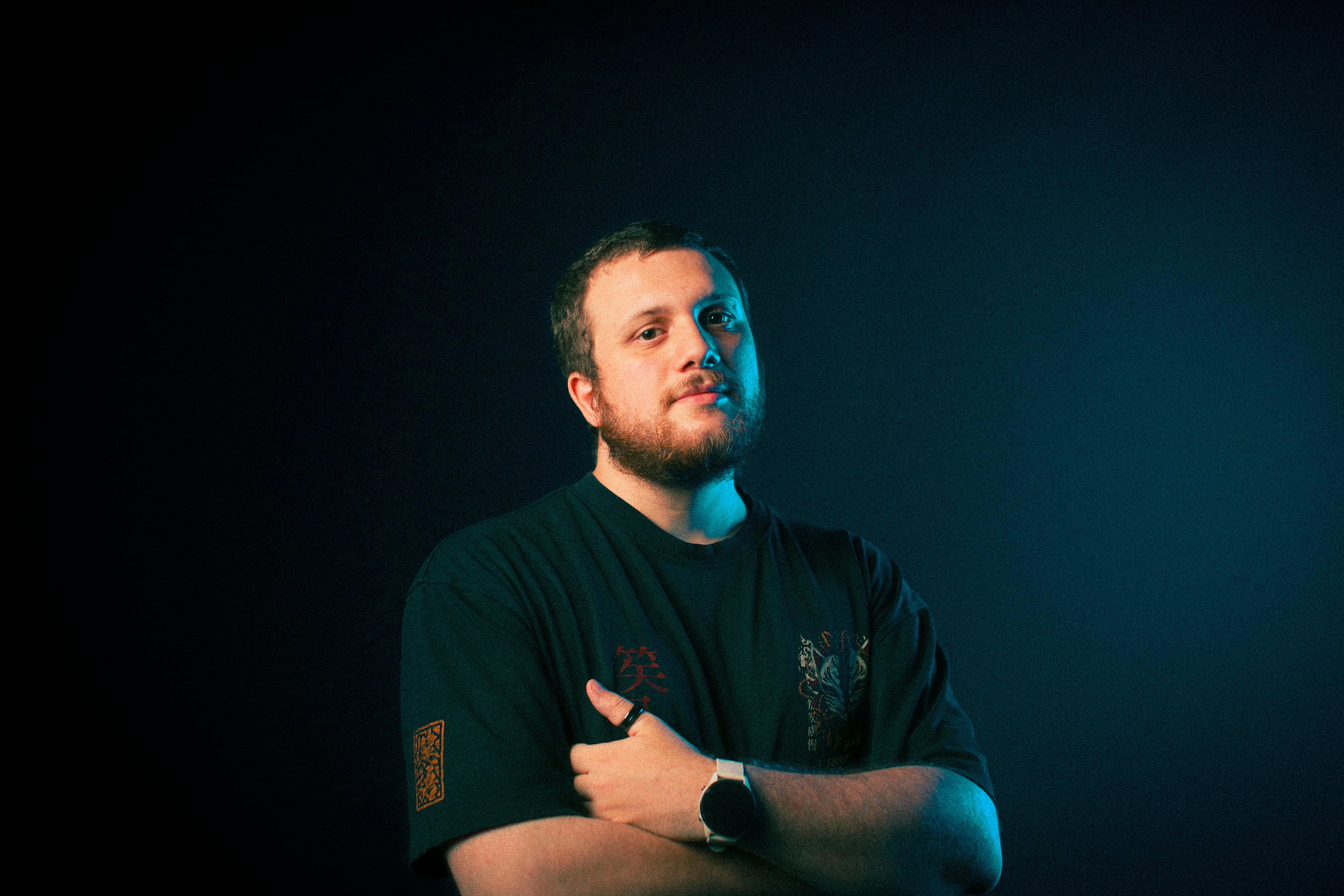 Portrait of a confident man in dramatic lighting, conveying strength and determination.