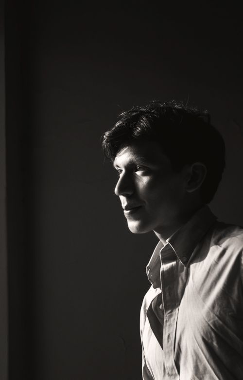 Free Moody black and white portrait of a young man in thoughtful reflection. Stock Photo