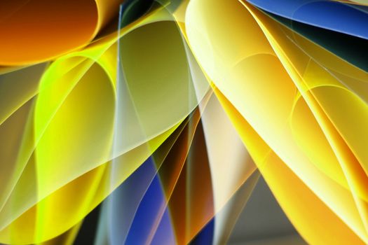 Colorful abstract artwork with wave-like patterns in yellow, blue, and orange hues.