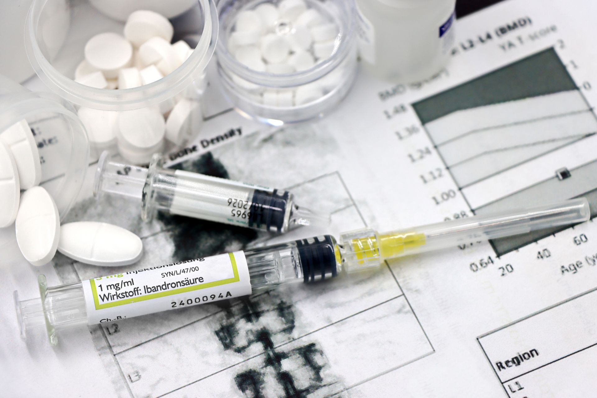 Medical arrangement of osteoporosis treatment tools with injections and pills.
