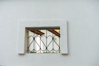 Small Window with Bars in Wall