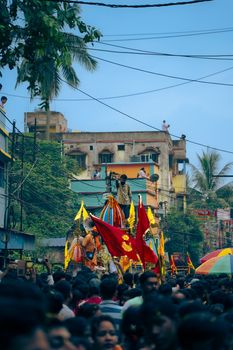 A bustling crowd participates in the vibrant Rath Yatra festival, showcasing Indian culture and spirituality.