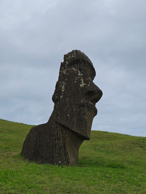 Free A solitary Moai statue in a serene landscape on Easter Island. Stock Photo