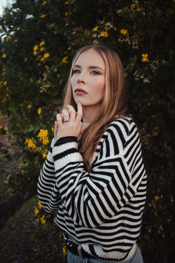 Woman in striped breton sweater and jeans