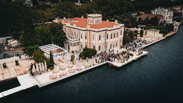 Stunning aerial photo of a wedding event at a historic mansion on the Bosphorus in İstanbul, Turkey.