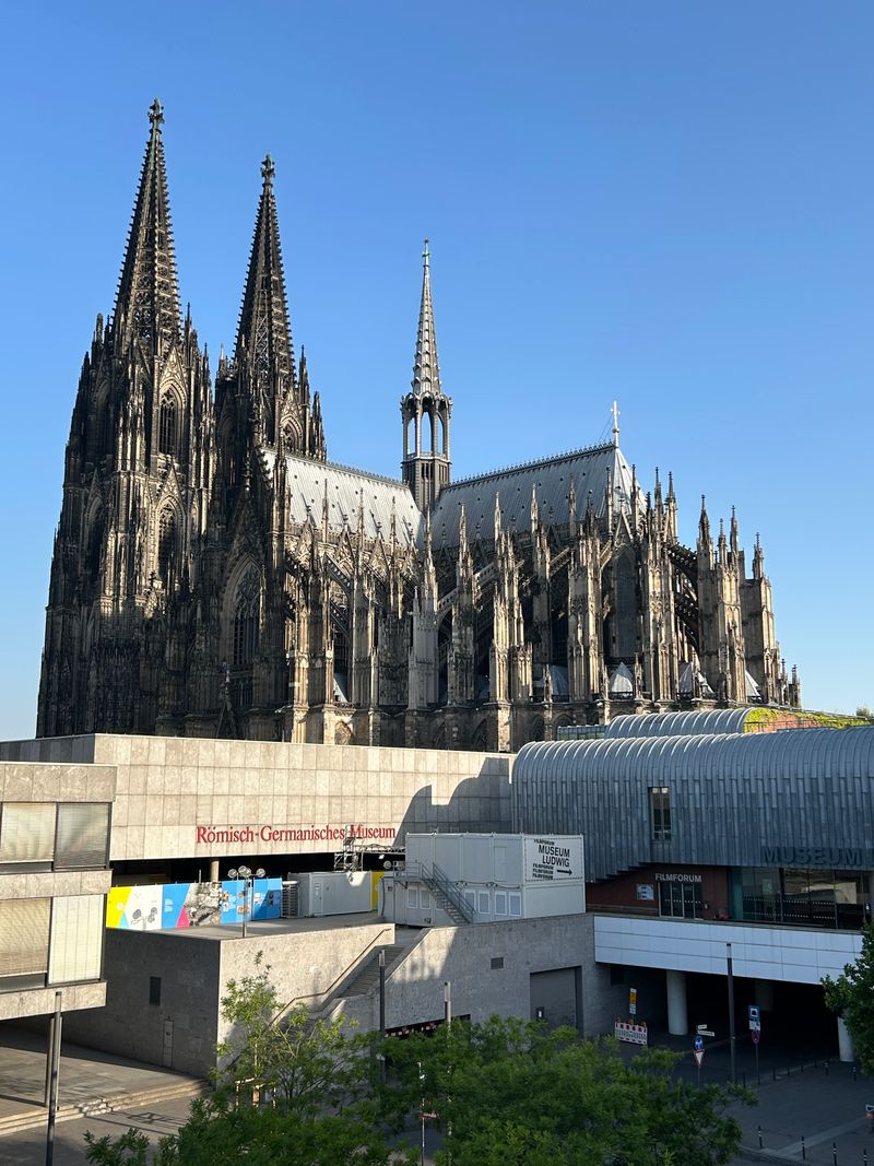 Cologne Cathedral towers against a blue sky
