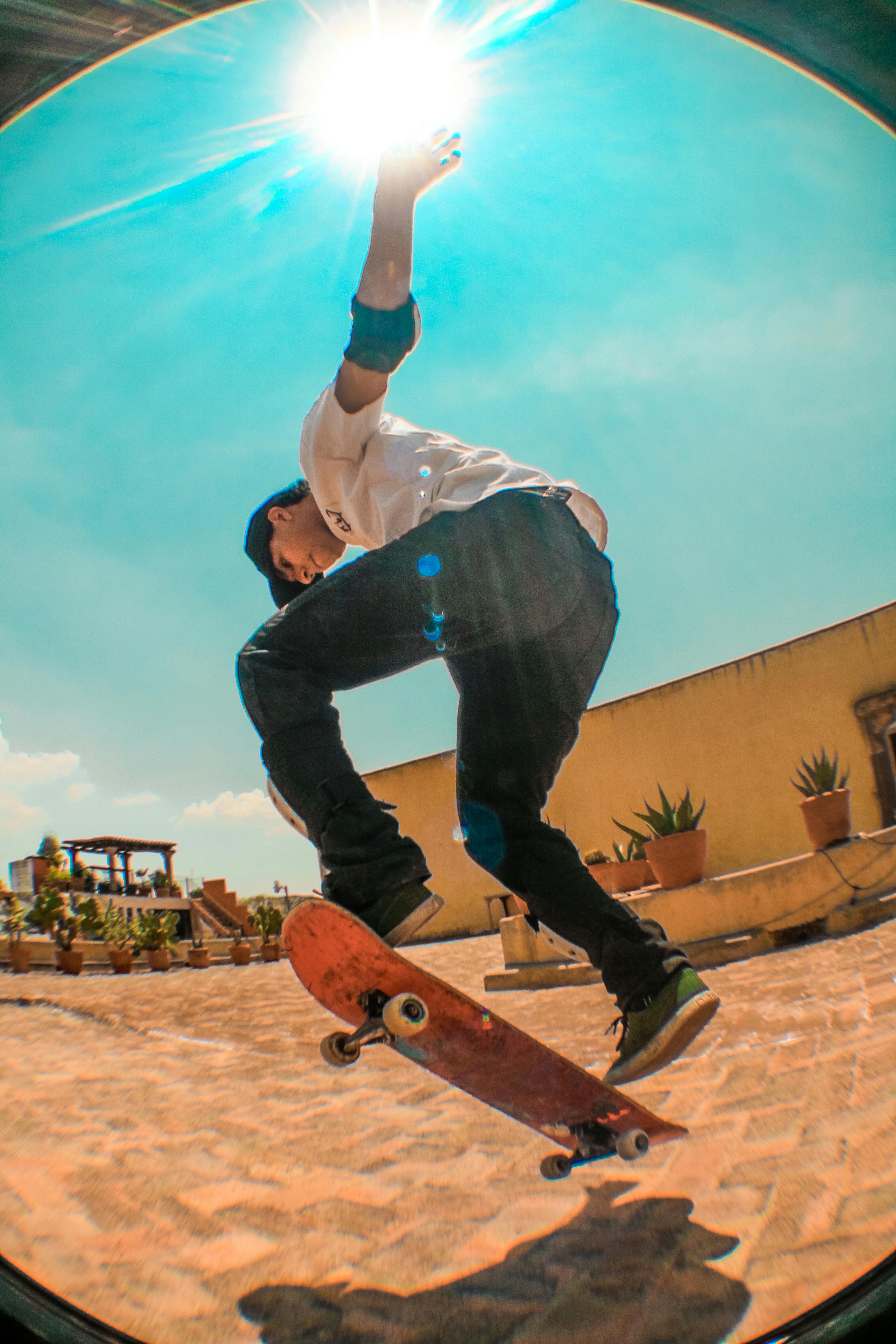 Skater performs a trick on a sunny day in San Miguel de Allende.