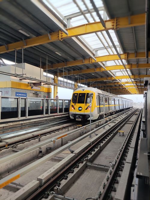 Free A metro train at Indore station featuring striking yellow accents, showcasing modern urban transit. Stock Photo