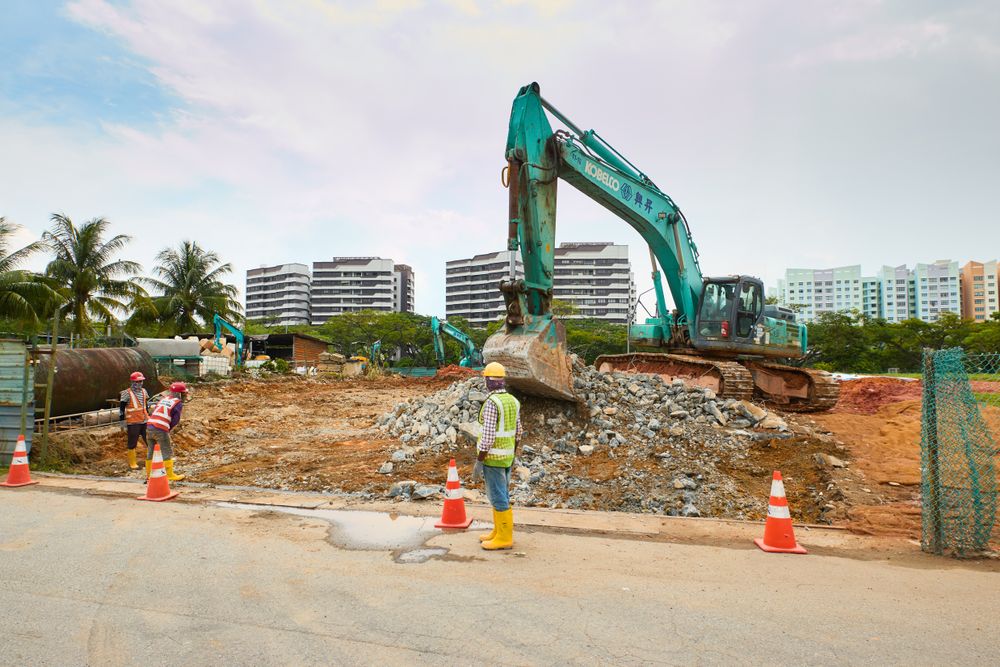 Excavators and workers on an earthworks construction site