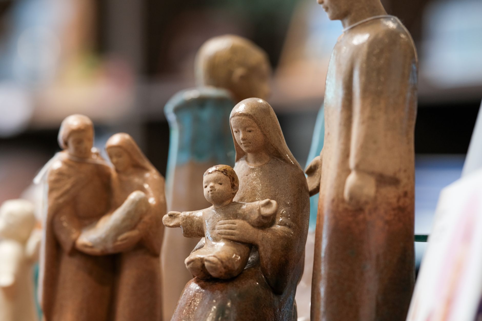 Close-up of ceramic nativity scene statues, capturing the holy family in a Tokyo store.