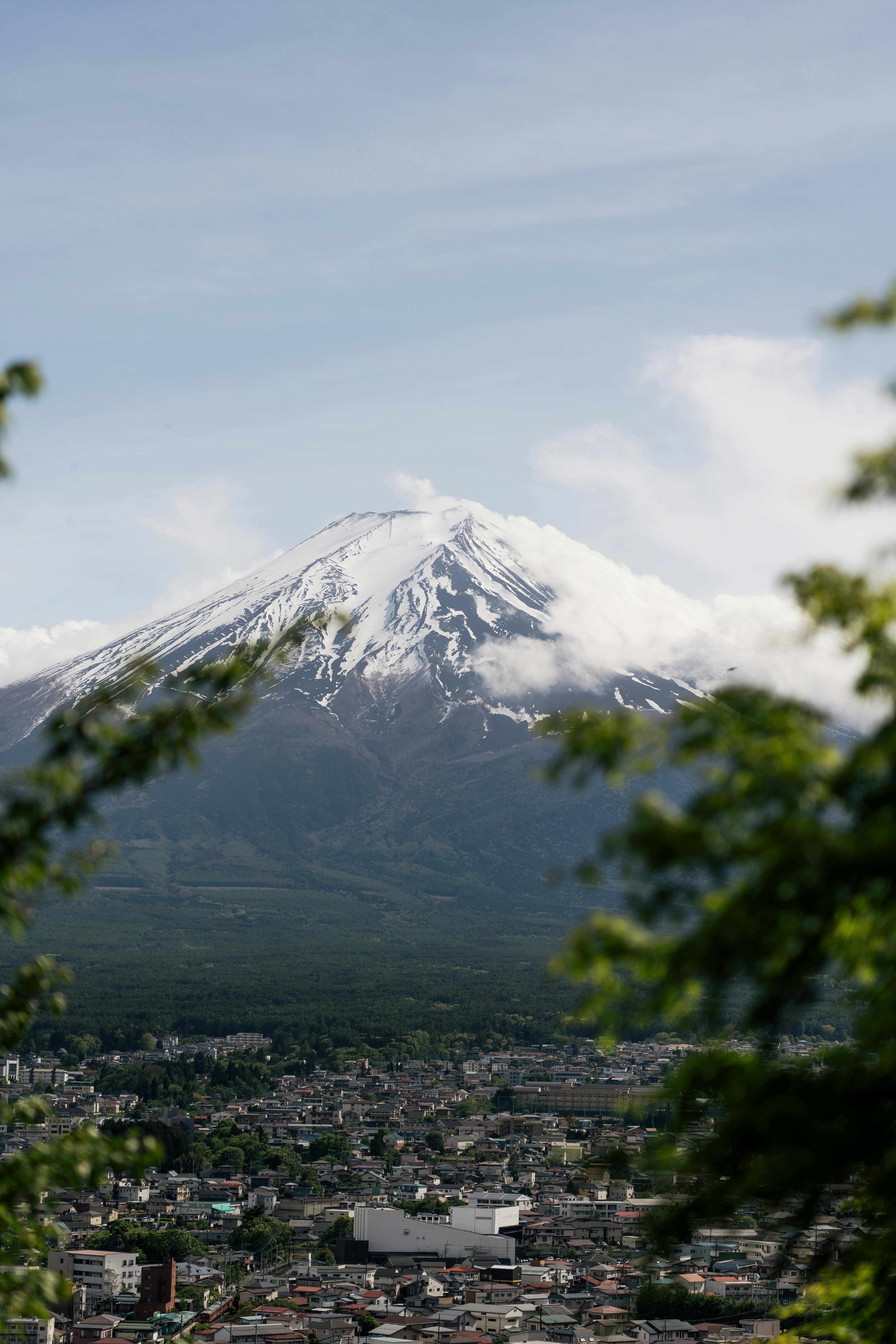 Breathtaking view of Mount Fuji with a snow-capped peak on a clear day.