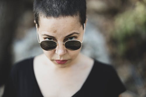 Woman In  Black Scoop-neck Shirt With Sunglasses