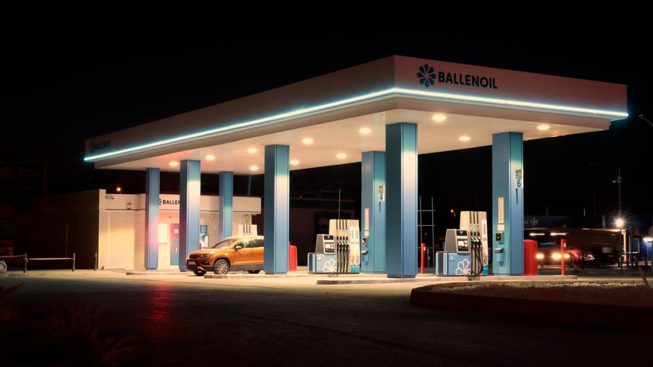 A self-service petrol pump at an Italian gas station with fuel prices displayed