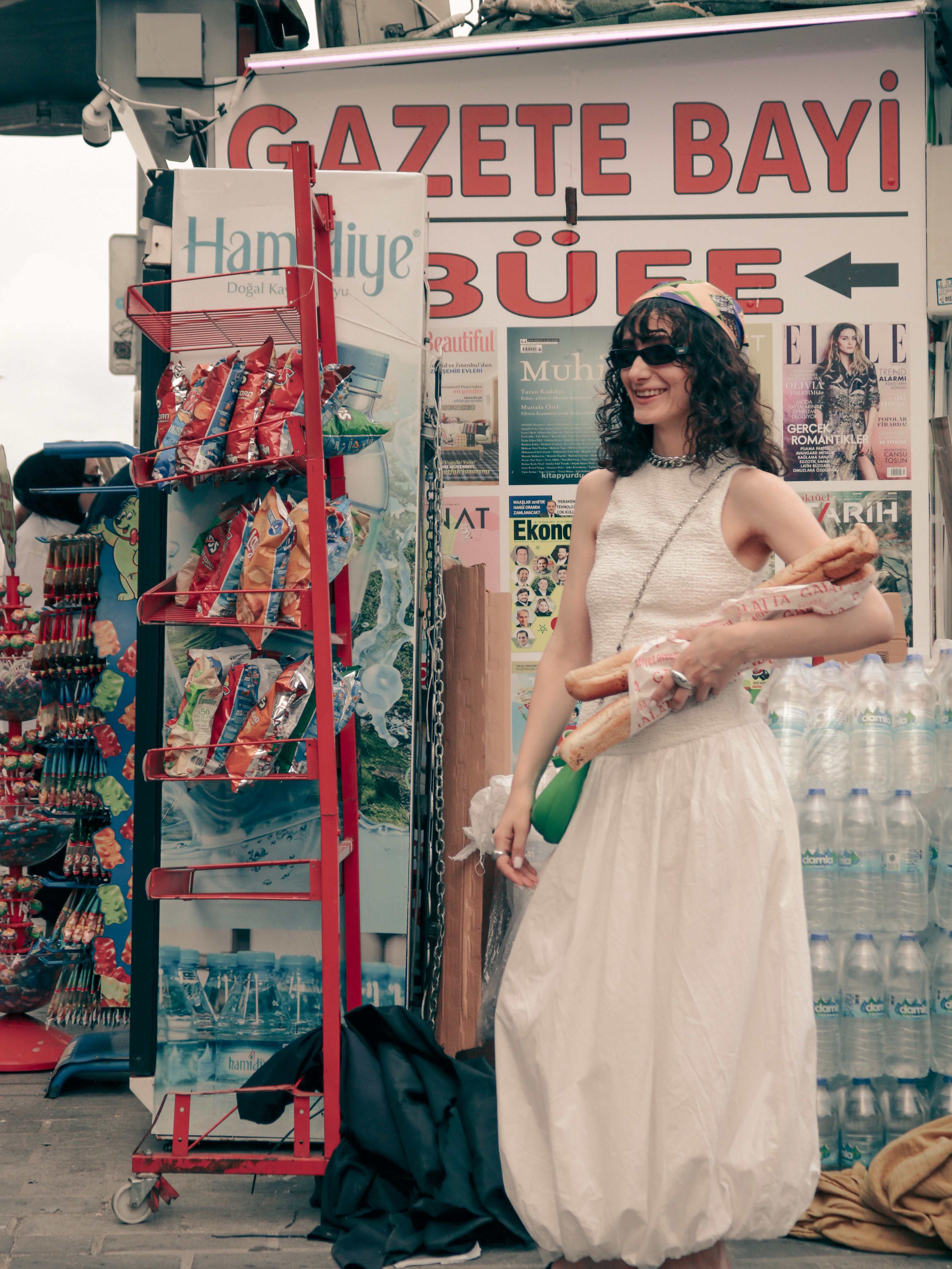 Woman Shopping at Newspaper Kiosk in Summer · Free Stock Photo