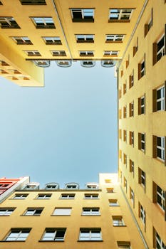 Explore the symmetry and vivid colors of modern architecture in Berlin, captured from a unique upward perspective.