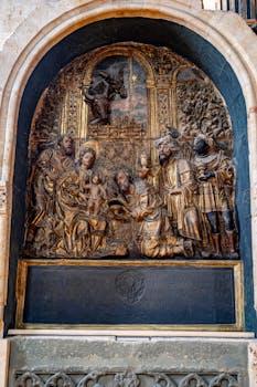 Intricate religious relief sculpture displayed in Salamanca Cathedral, Spain