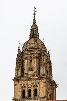 The ornate bell tower of Salamanca Cathedral in Spain, showcasing intricate Gothic architecture.