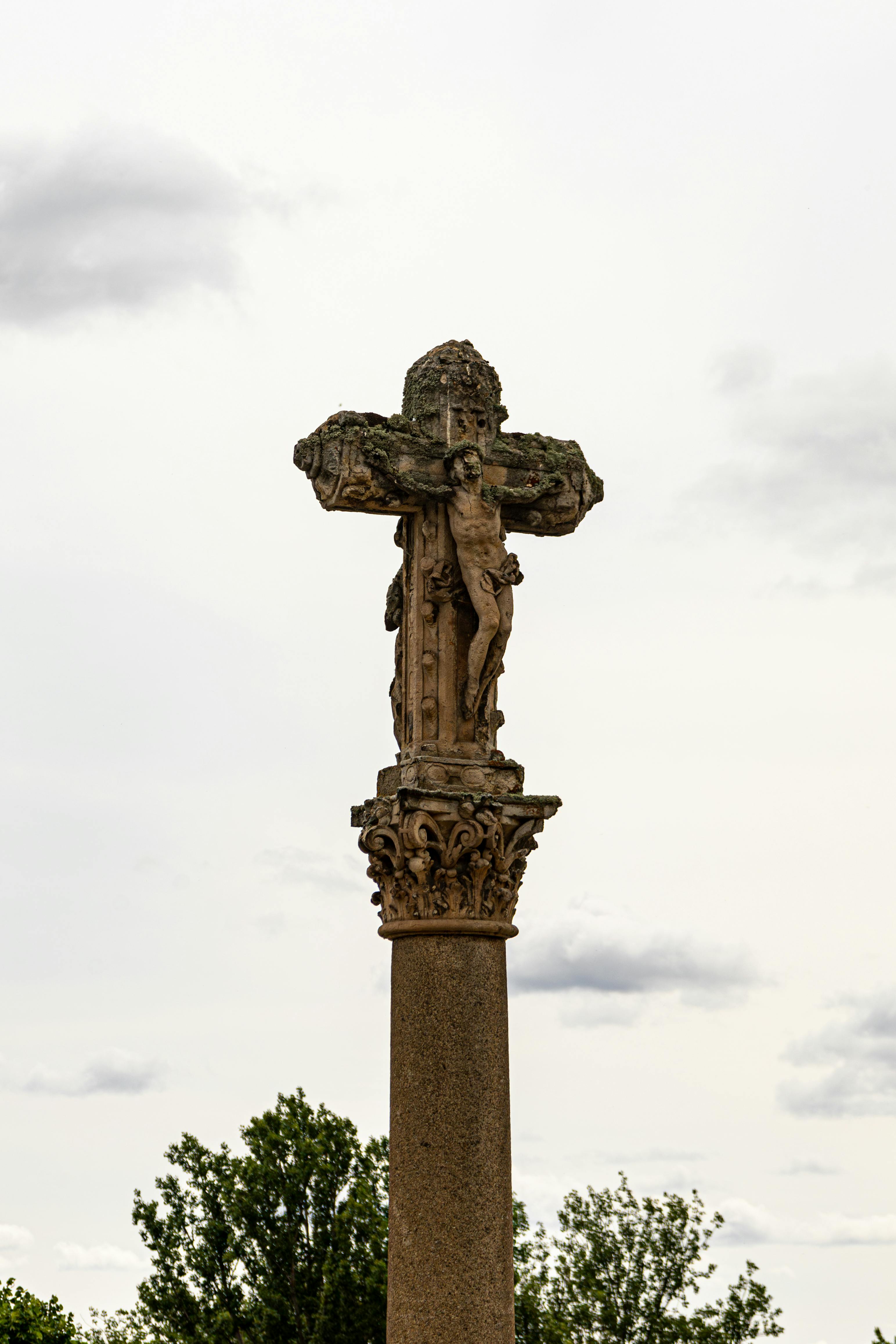Historic stone cross with intricate carvings in Salamanca, Castile and León, Spain.
