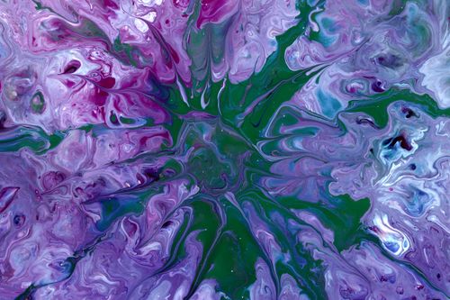 Free Colorful abstract artwork featuring purple and green acrylic pour patterns. Stock Photo
