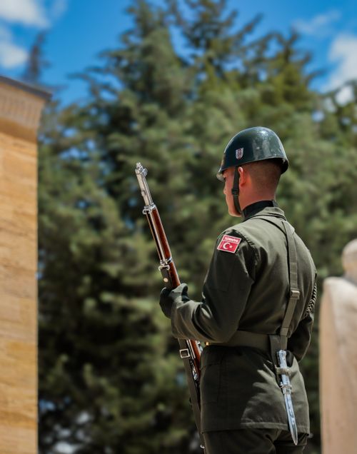 Free Soldier on duty at Atatürk Mausoleum in Ankara, Türkiye, under clear blue skies. Stock Photo